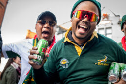 Noisy South Africa rugby fans drinking beer
